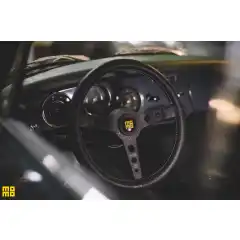 - Black leather<br />
- Spoke Finish: Black<br />
- Rim Diameter: 30 x 33mm (1.18 x 1.14 in)<br />
- 350mm (13.78 in) Diameter<br />
<br />

<img alt="momo" src="https://www.design911.com/uploads/images/car_logo/momo.gif" title="momo" /><br />
<br />
Designed to recreate the history of MOMO, the Prototipo Heritage is a classic-look wheel made in a combination of the finest modern materials giving it the perfect blend between old and new.<br />
<br />
Produced from distressed leather with white stitching, and a choice of either black or silver cut-out spokes with the MOMO Heritage horn button, the MOMO Prototipo Heritage is the ultimate choice for those wishing to retain the character of their vehicle whilst refreshing the interior.<br />
<br />
<b>NFC: Advanced Technology for your steering wheel</b><br />
When purchasing a product, quality and authenticity are essential and vital conditions<br />
for every costumer. MOMO, always fighting against forgery and to safeguard "Made<br />
in Italy" in the spring of 2021 introduced the advanced NFC (Near Field<br />
Communication) technology for the first time ever in steering wheels by<br />
applying it to its products making them capable of communicating with the buyer.<br />
<br />
Thanks to NFC it will be possible to verify in real time the genuinity of a MOMO<br />
steering wheel directly from your own compatible smart devices (smartphone, tablet,<br />
smartwatch, etc) and you will also have access to exclusive contents, directly released<br />
by MOMO, reserved to whom will register his own original MOMO steering wheel.<br />
<br />
NFC technology's potential is enormous and constantly evolving, giving the possibility<br />
to enrich the value and the features of the MOMO's steering wheel range.<br />
NFC equipped steering wheels were be available on the market from spring 2021<br />
<br />
<b>VERIFIED BY MOMO</b><br />
The chip, in most of the steering wheel's range,<br />
is hidden in the right section in the back, near<br />
the handle. The chip's detection is reached just<br />
approaching the compatible device in proximity<br />
of the mentioned area.<br />
Every MOMO's steering wheel comes with a warning label,<br />
in its packaging,with the user manual and the exact indication of<br />
the chip's placement depending on the steering wheel model<br />
<br />
<b>PLEASE NOTE: This product requires a fitting kit.</b><br />
<br />
<b>PLEASE NOTE: Rattet trenger ett boss/hub til din bil -vi har p&aring; lager til Porsche fra 1964-2012 modeller av 911</b>
<footer>
<h5></h5>
</footer>
